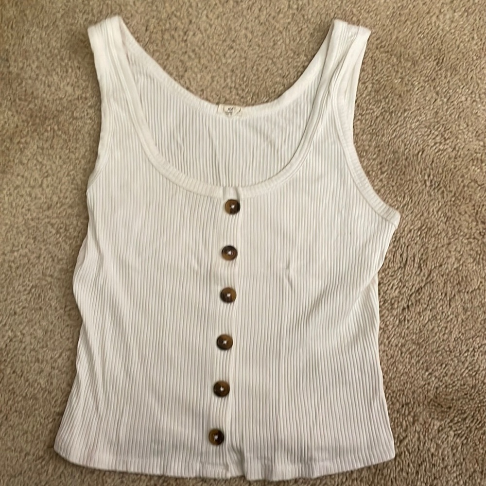 This is a white top with brown buttons.